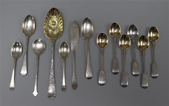 A set of six late Victorian silver fiddle patter egg spoons, London, 1894 and other items of flatware including a berry spoon.